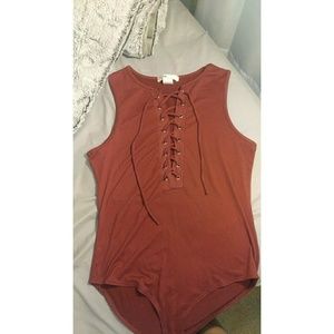 Sleeveless maroon bodysuit